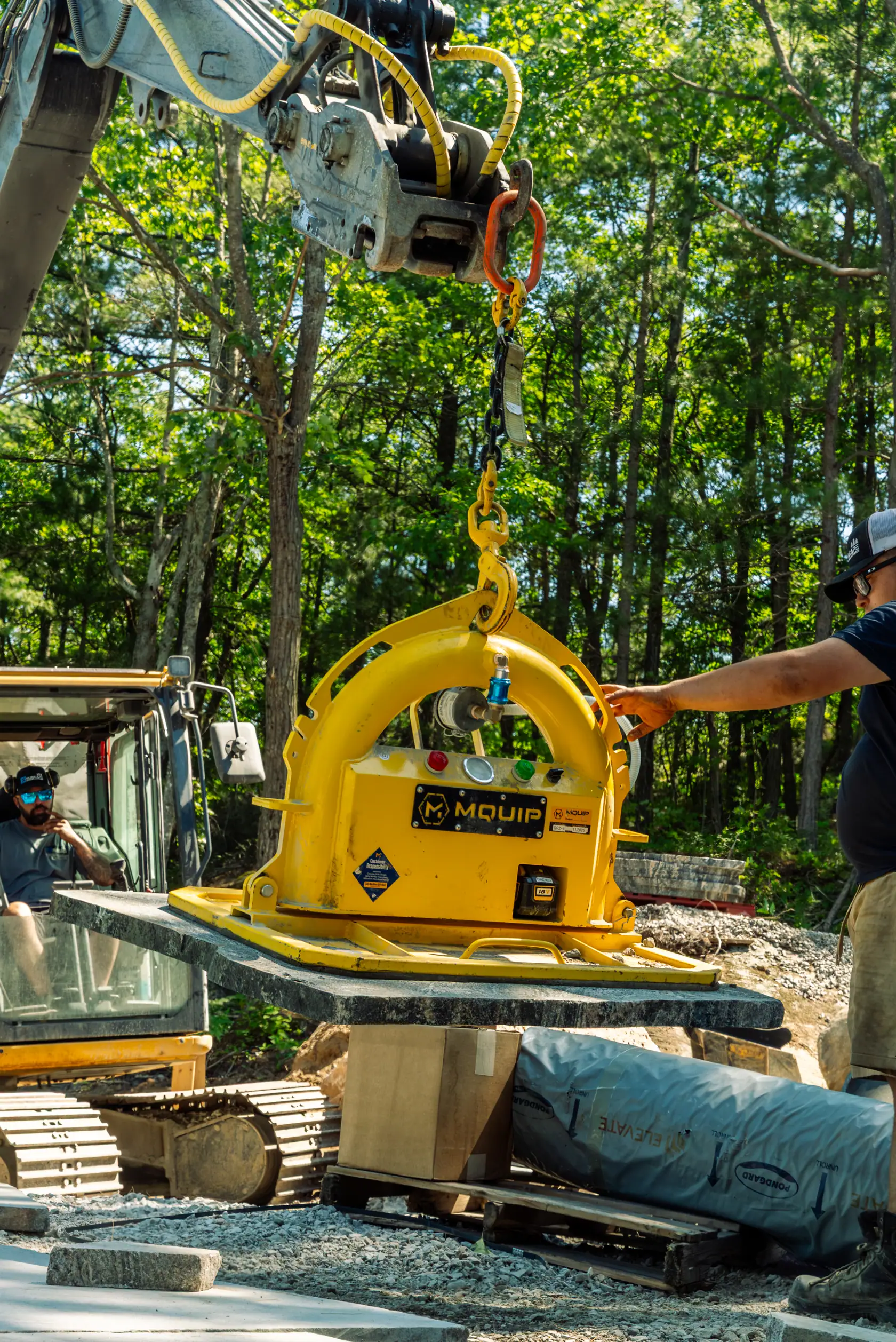 Vacuum lifter placing a granite slab on site