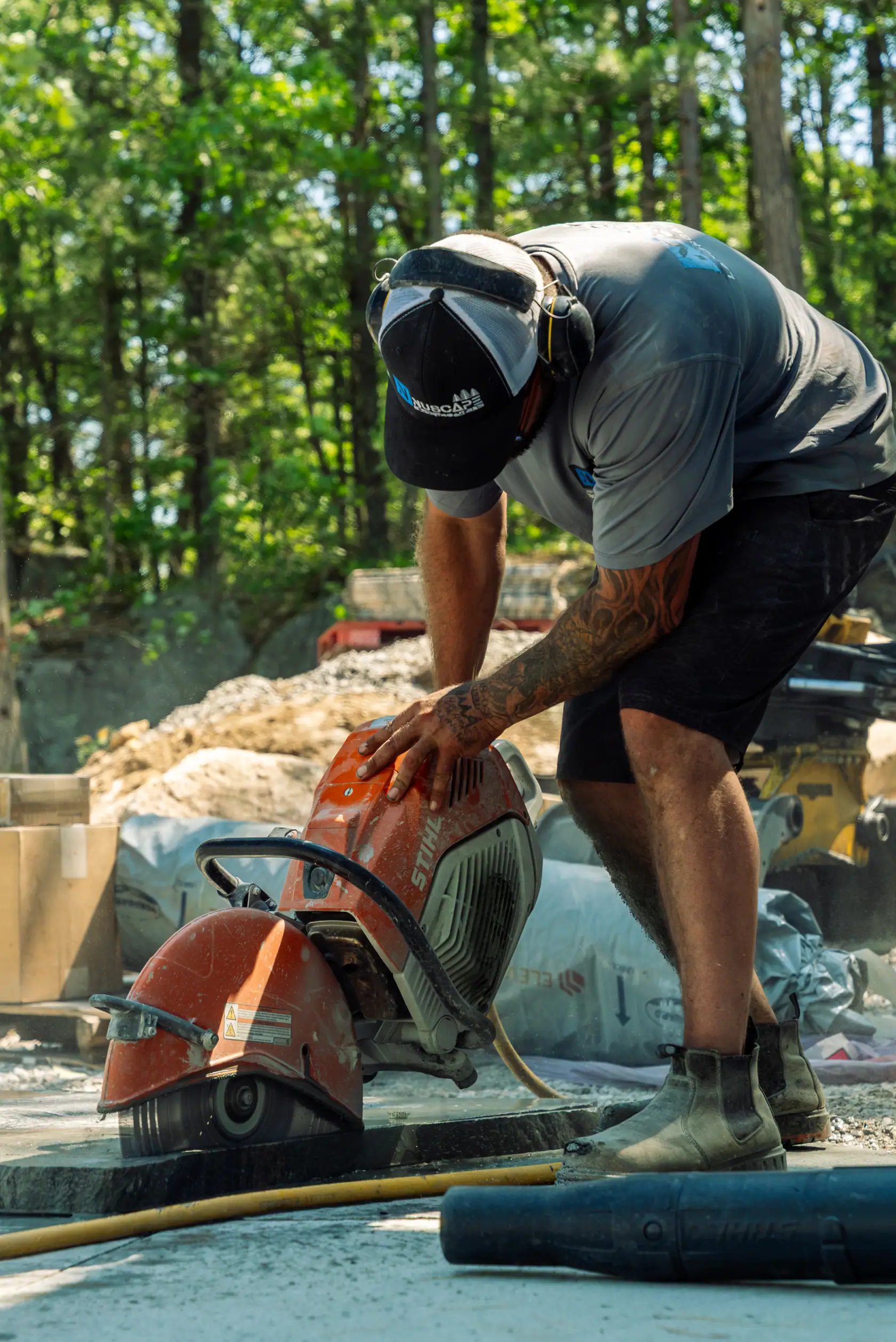 NuScape stonemason cutting granite on site